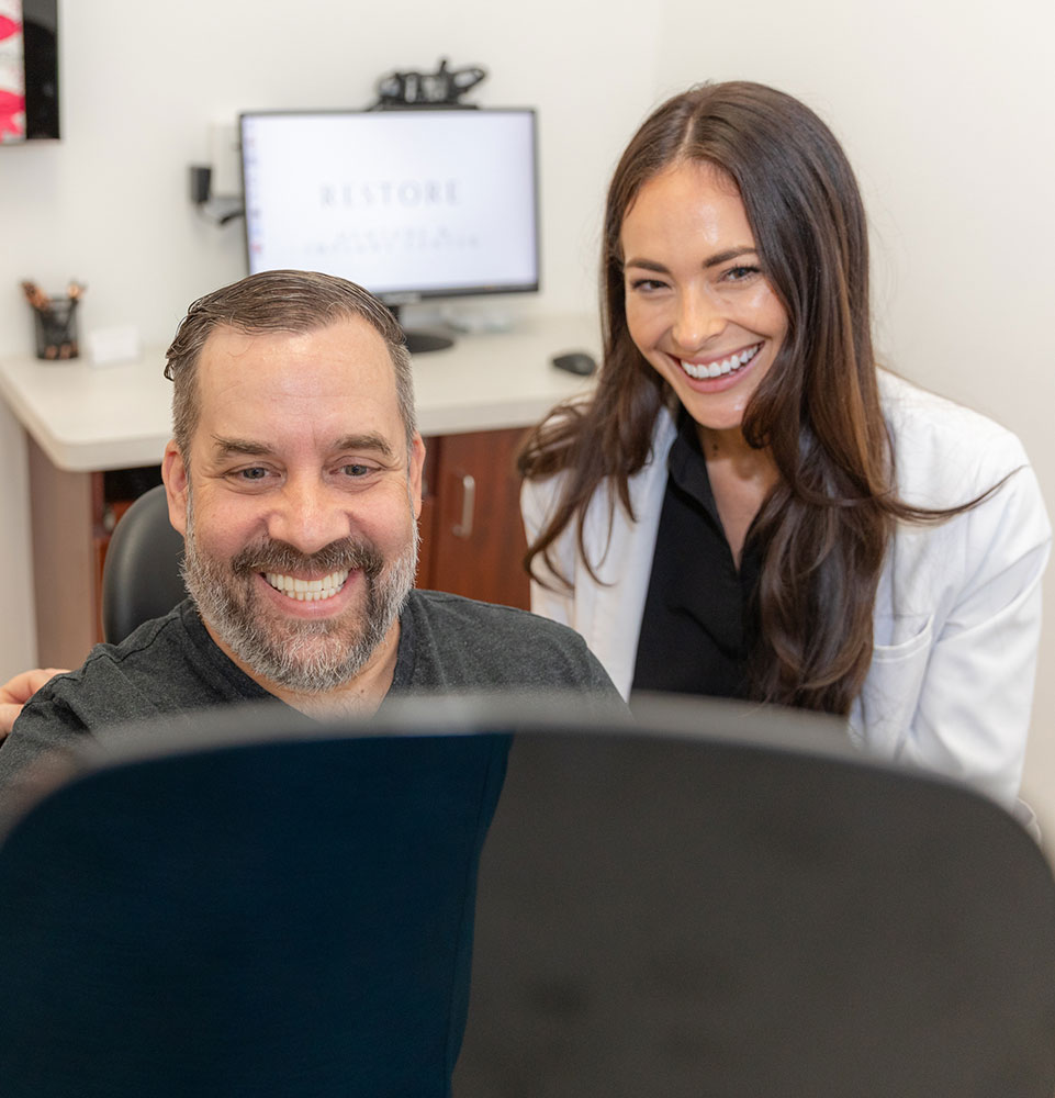 Dr. Mencini at full arch implant consultation with patient